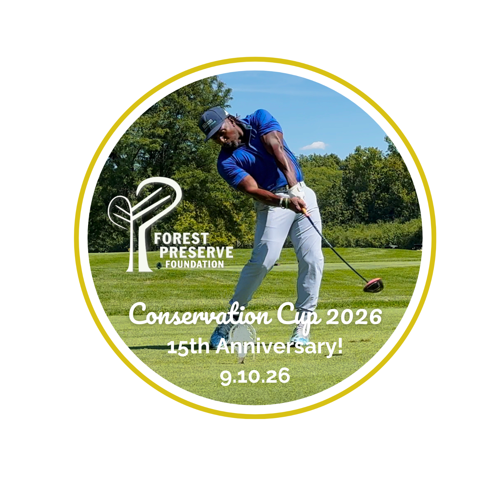 Golfer in a bright blue shirt and light gray pants swinging at a ball with trees